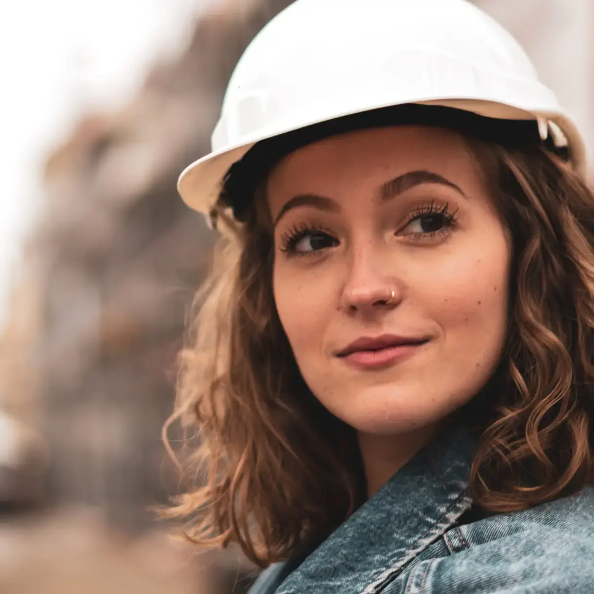 Young woman wearing a hardhat
